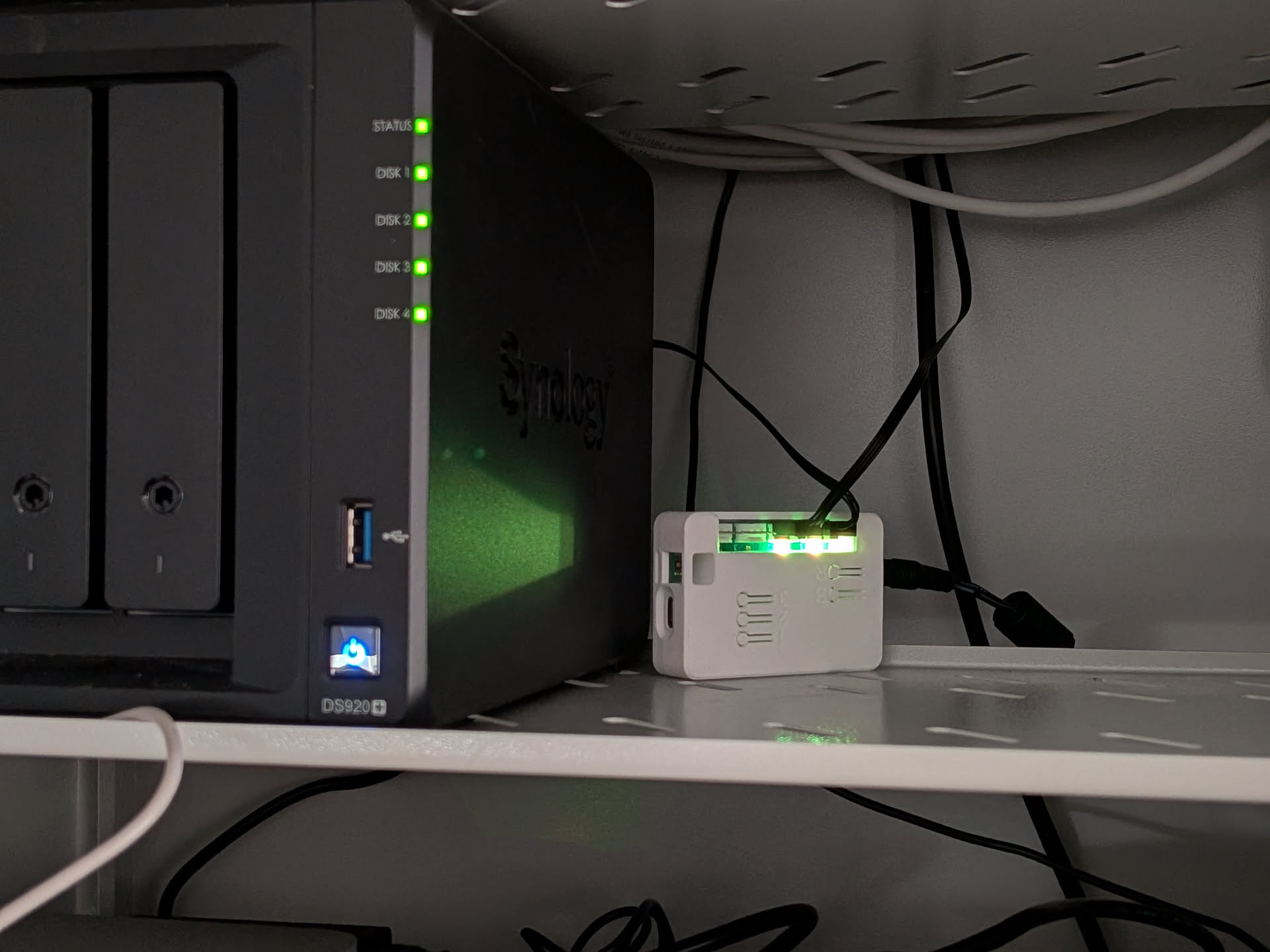 ESP32 WiFi Fan Controller installed next to a Synology DS920+ NAS in a 12U network rack