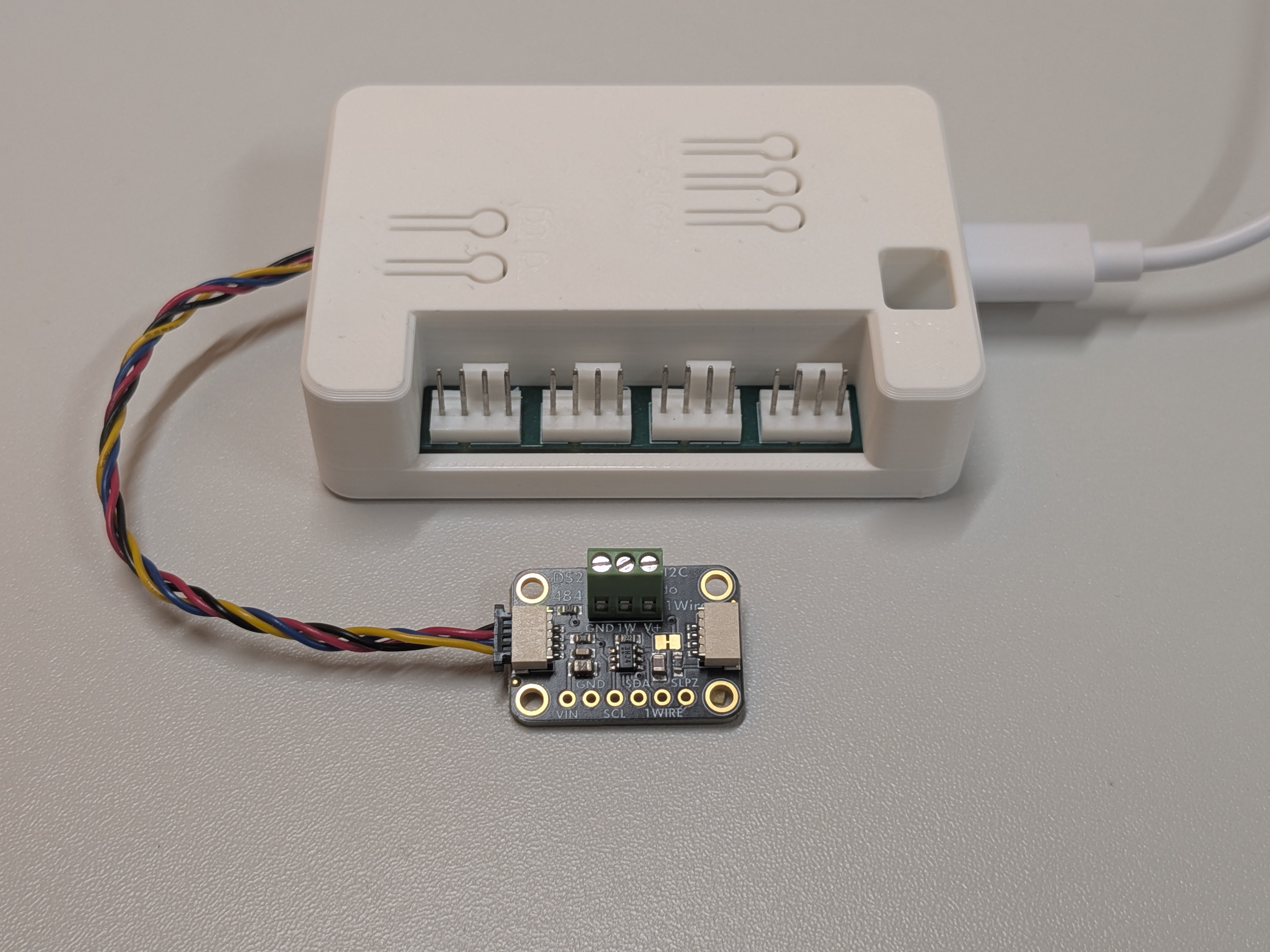 WiFi Fan Controller with an Adafruit DS2484 I2C-to-1-Wire bridge connected over Qwiic, with a DS18B20 temperature sensor on the 1-Wire bus
